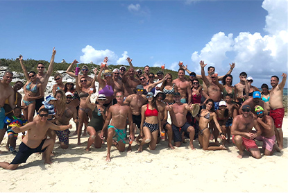 photo of a group of people with swimsuits on the beach