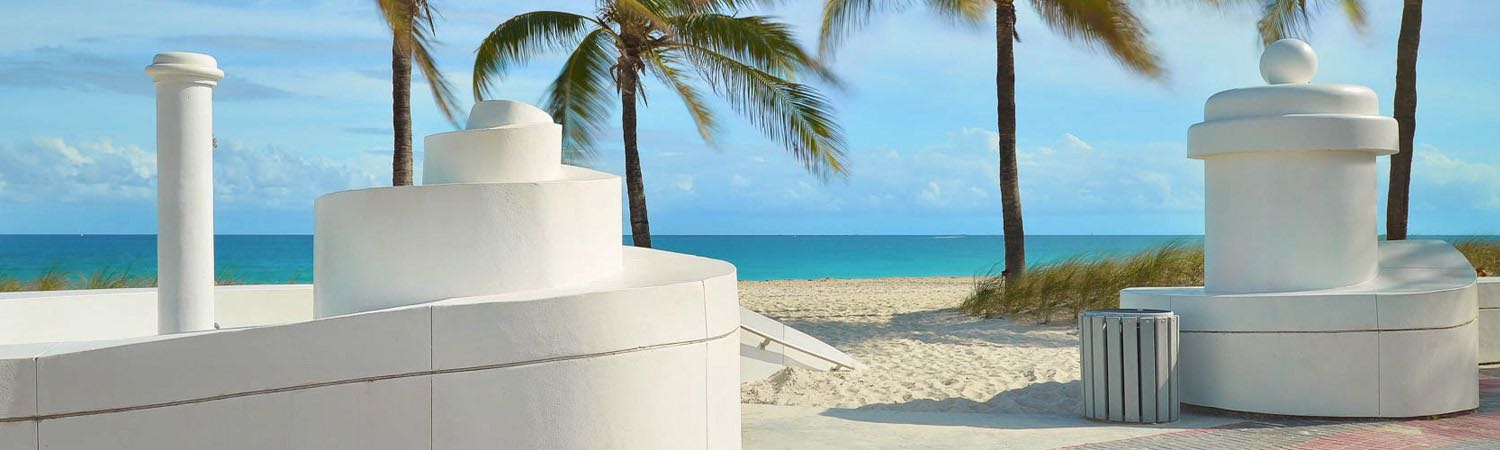 Las Olas beach with palm trees and blue waters