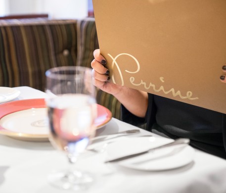 a woman reading the Perrine menu