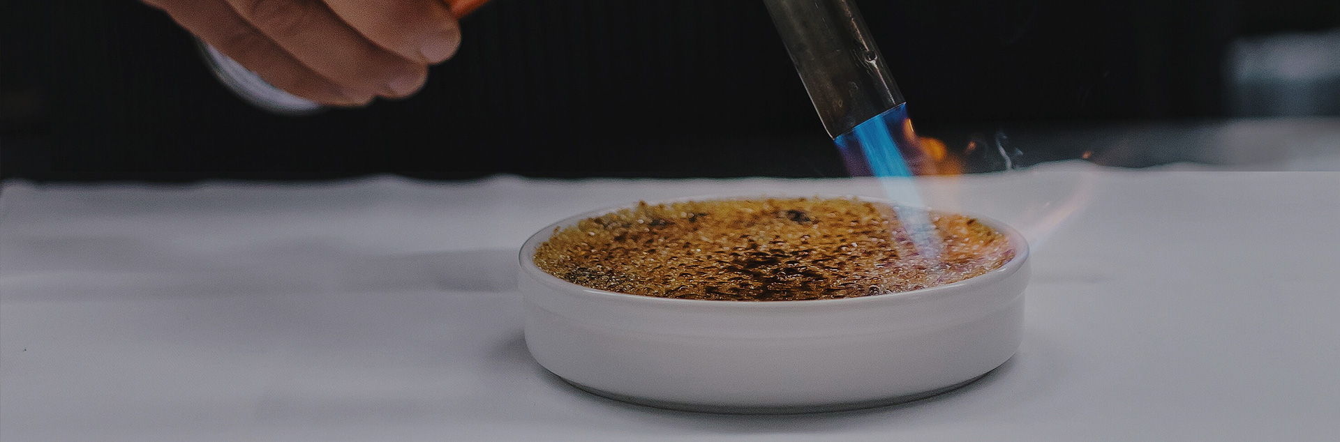 a creme brulee being prepared