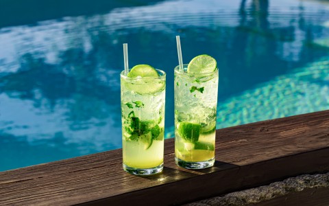 two mojitos by pool