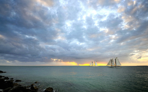 key west sunset with sailboats in the distance