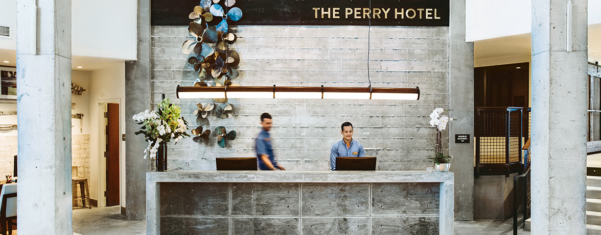 The Perry hotel reception in gray and white accents 