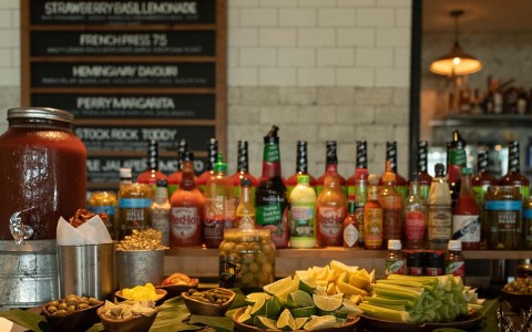 view of all different sauces, dressings and slices of lemon in the bar