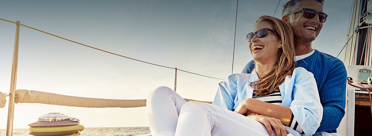 man and woman siting together on a boat
