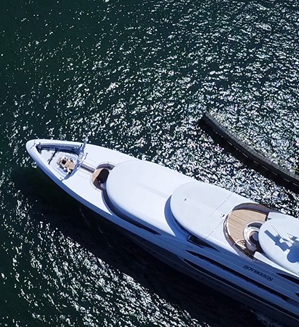 a large white yacht docked along the intracoastal waterway