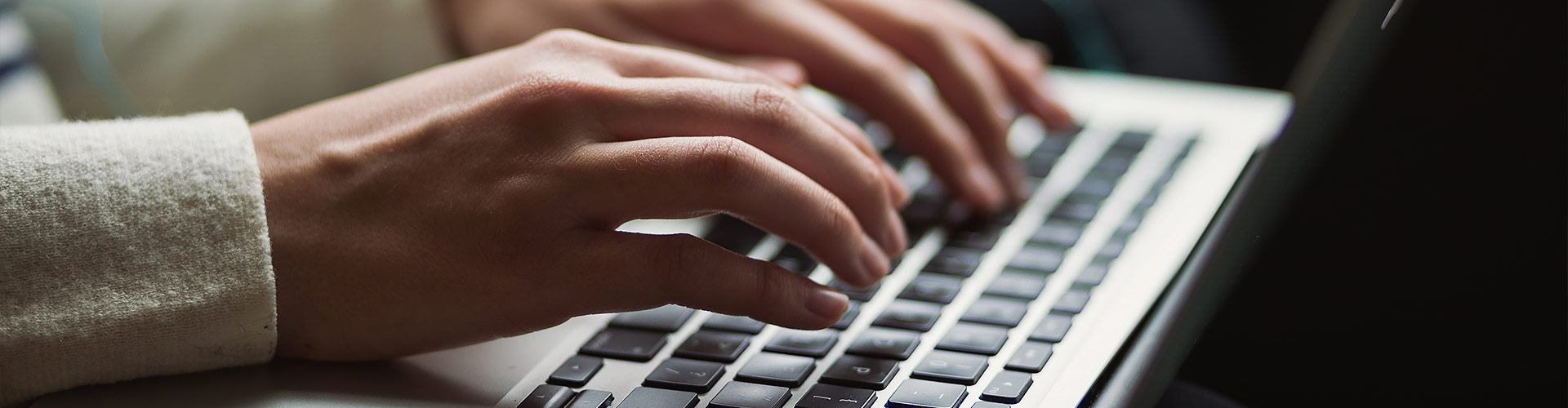 Person typing on laptop