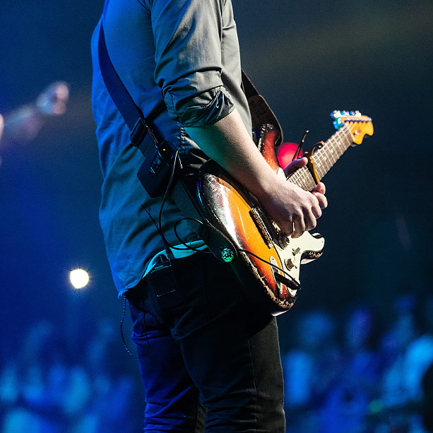 Man playing guitar on stage