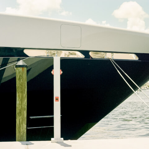 close up view of a boat's bow docked in the intracoastal