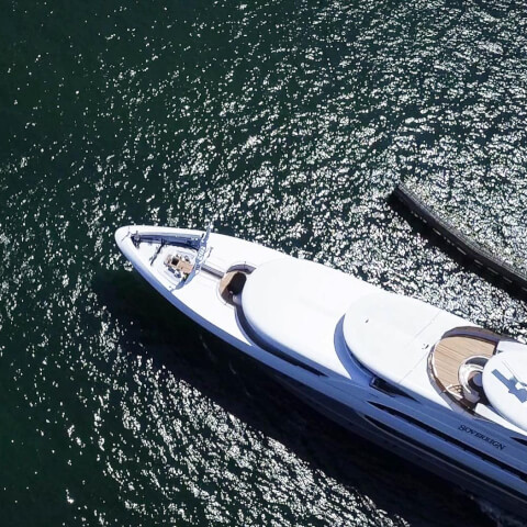 aerial view of a long yacht in the ocean