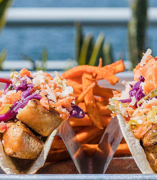 two fish tacos with sweet potato fries