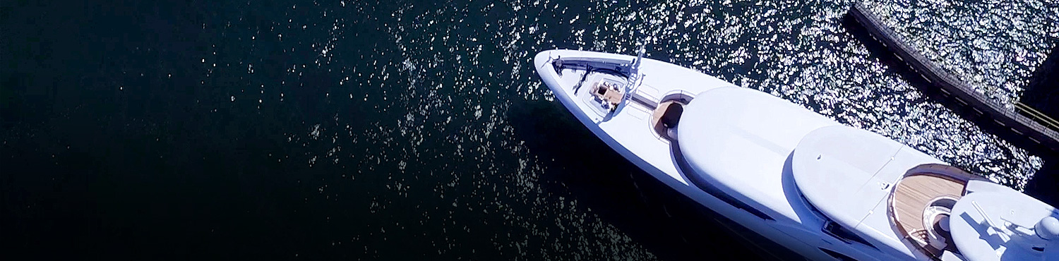 aerial view of a long yacht in the water