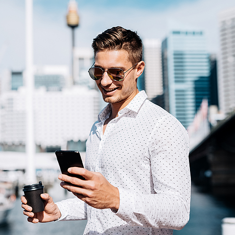 man talking on his phone next to his boat