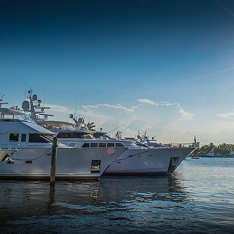 two boats docked in the waterway at dusk