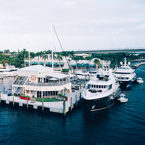 aerial view of Pelican Landing Restaurant exterior with a boat docked next it