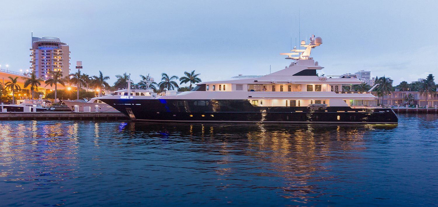 large yacht docked at twilight