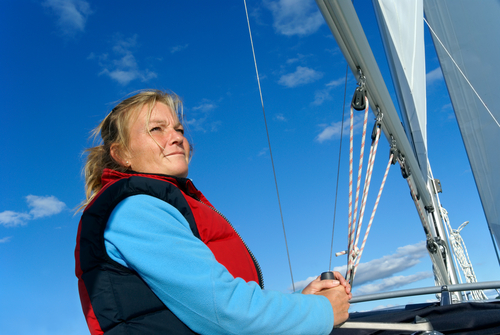 woman steerling sailboat