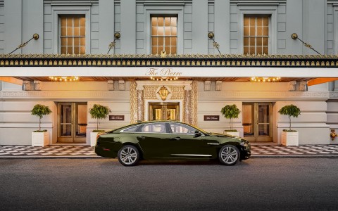 exterior of hotel with green car parked