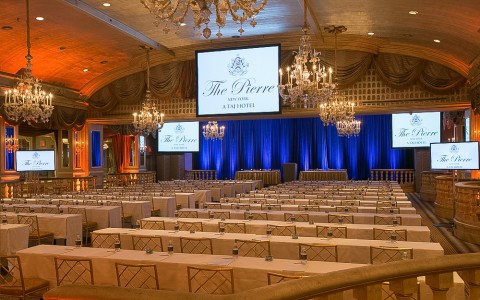 large ballroom set up for a meeting 