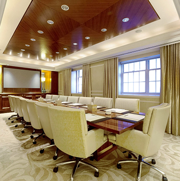 conference table with white leather chairs