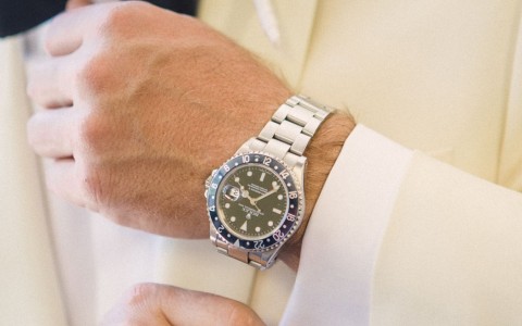 Closeup of a groom with a luxury watch 