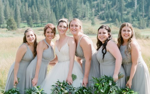 View of a lovely bride and her bridesmaids posing for a picture