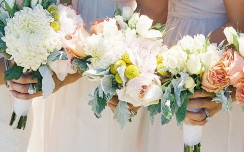 Closeup of some bridesmaid holding a bouquet 
