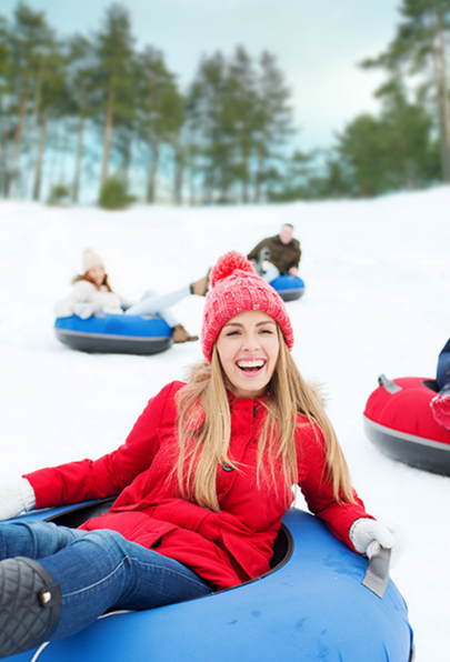 Group of people tubing in the snow