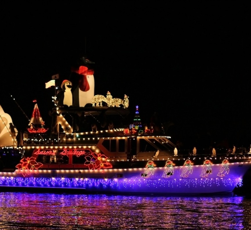 boat with christmas lights at night