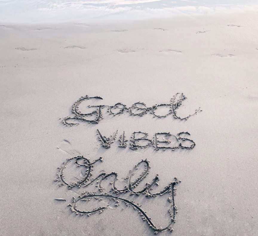 good vibes only written in the sand