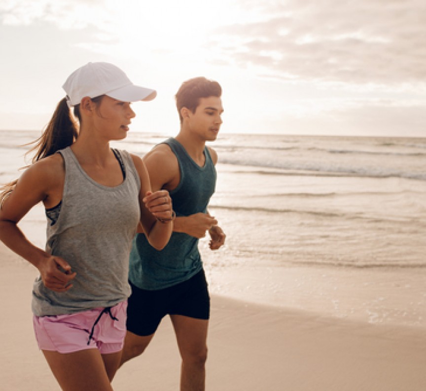 couple running on beach