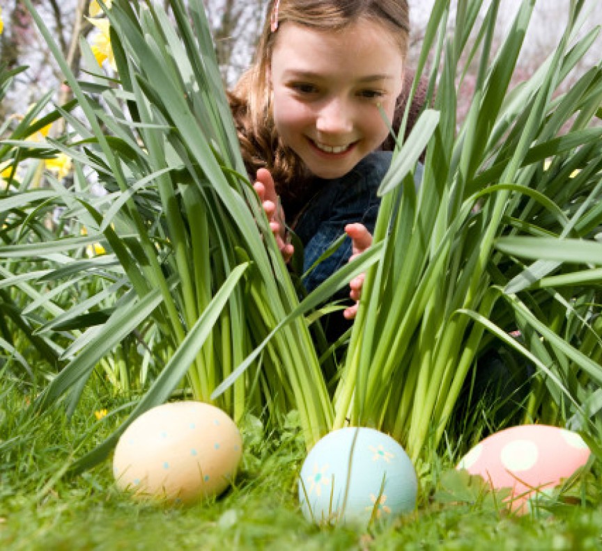child looking for easter eggs