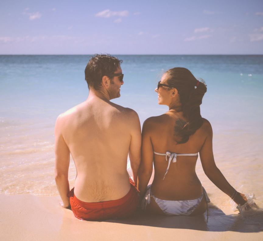 couple from behind on beach