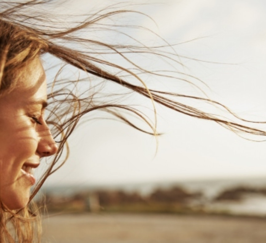 woman on beach in wind