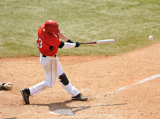 Baseball player swinging bat 