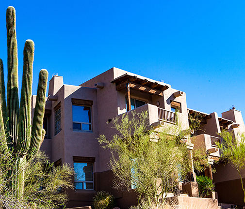EAGLE MOUNTAIN exterior of adobe building with clear blue skies