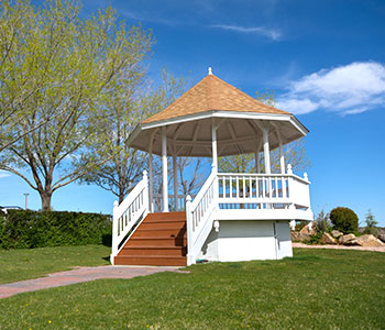 white gazebo in bright blue day