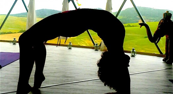 Silhouette of woman doing yoga pose
