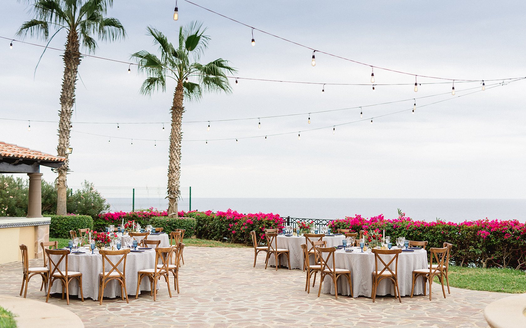 outside venue with string lights and ocean view