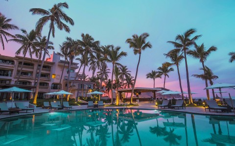 pueblo bonito mazatlan resort pool with palm trees during sunset