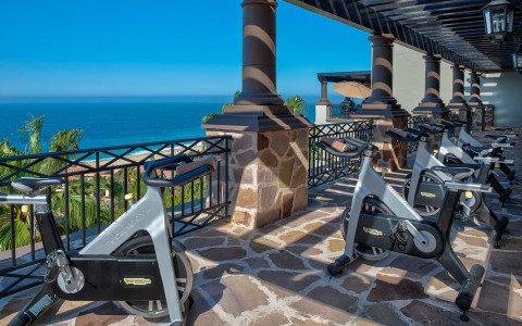 cycle bikes on patio overlooking ocean