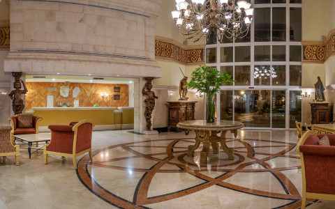 hotel lobby with front desk and seating area