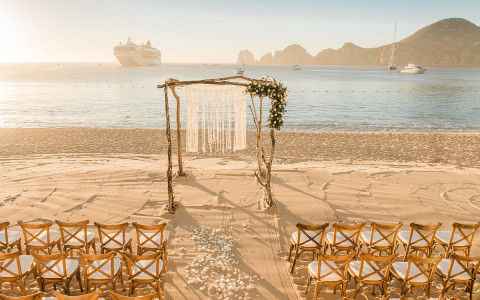 wedding ceremony set up by ocean