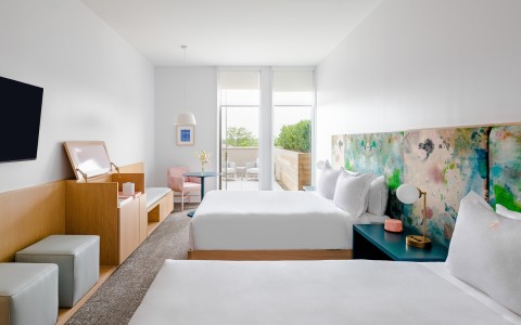 Internal view of a big room with two king size beds and a private balcony