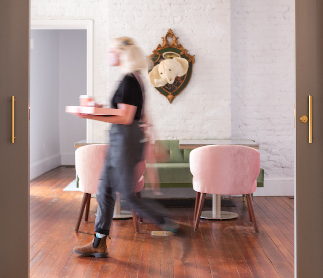 waitress walking holding cafe order