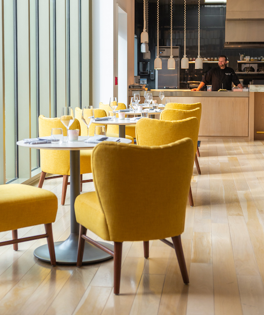 yellow chairs and tables at Pink Grouse restaurant 