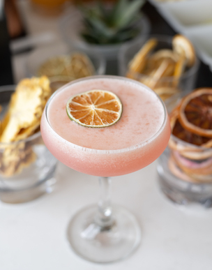 pink drink with orange slice