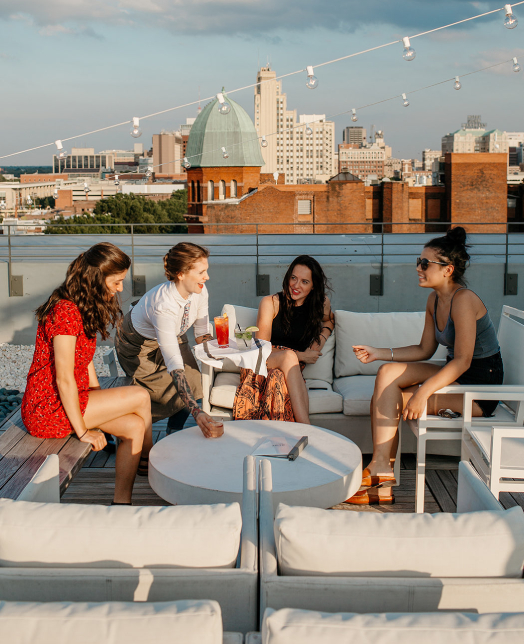 group of friends on a rooftop bar
