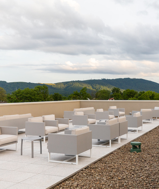 quirk hotel charlottesville rooftop terrace chairs and mountain view