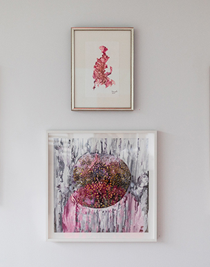 two paintings framed with pink colors 